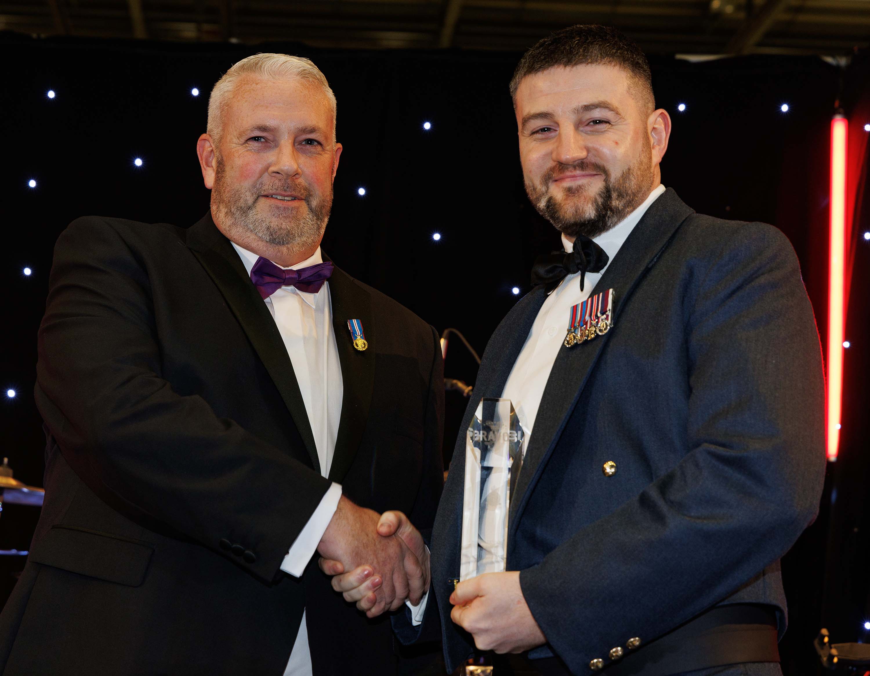 Photo: Image shows Sergeant Whitehead receiving the Operational Safety Award